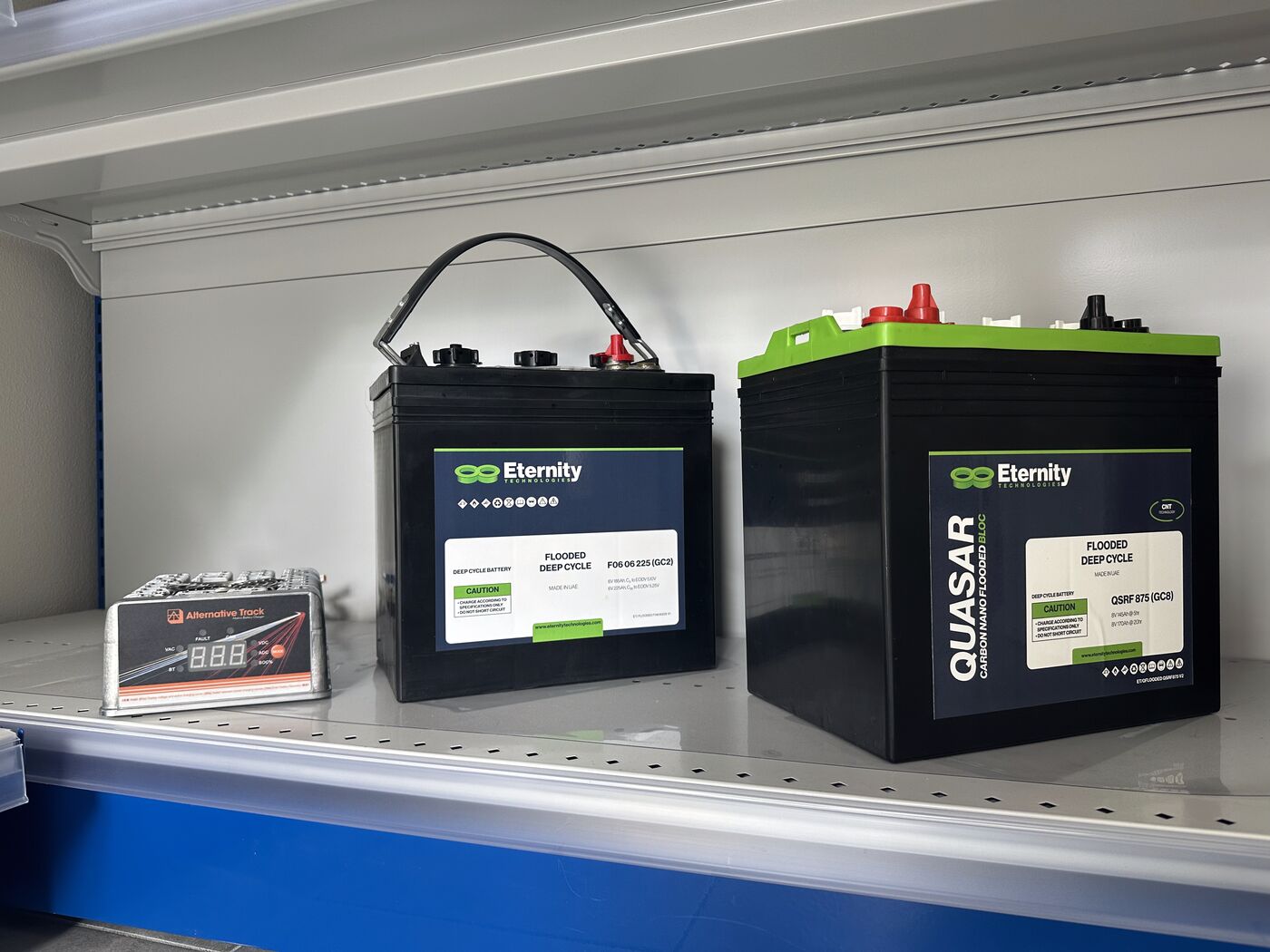 Multi-brand battery shelf with paired ALT chargers