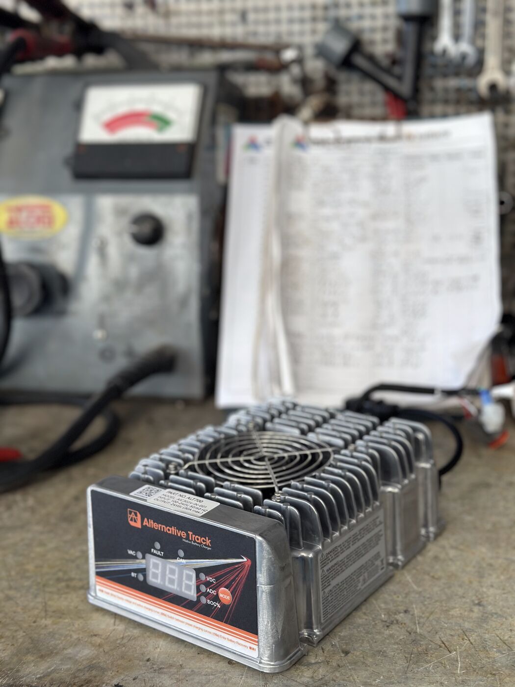 Detail shot of an ALT charger with brand label visible